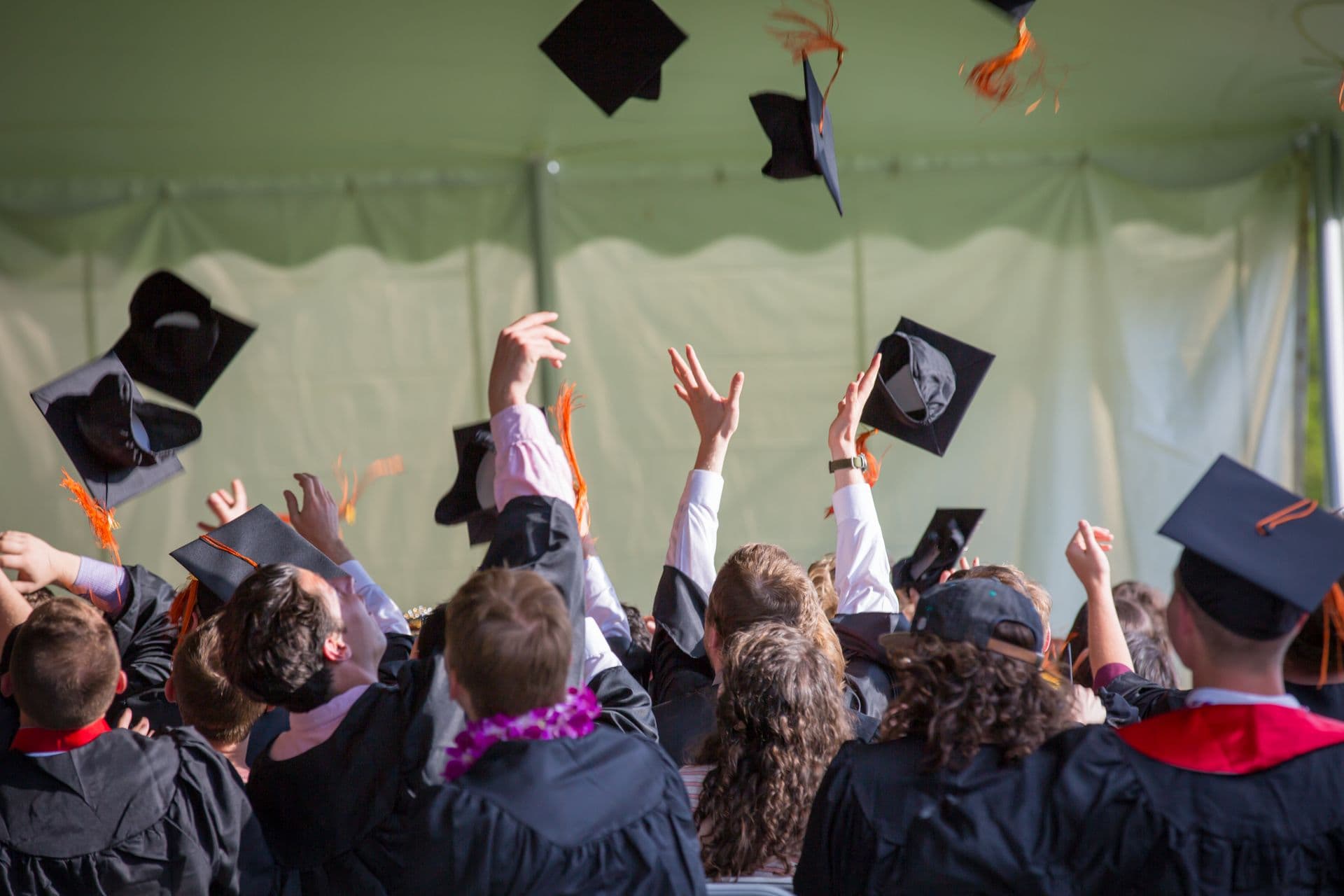 Graduates celebrating at an international university ceremony
